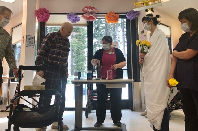 A mock wedding being performed at St. Martha's Place long-term care facility