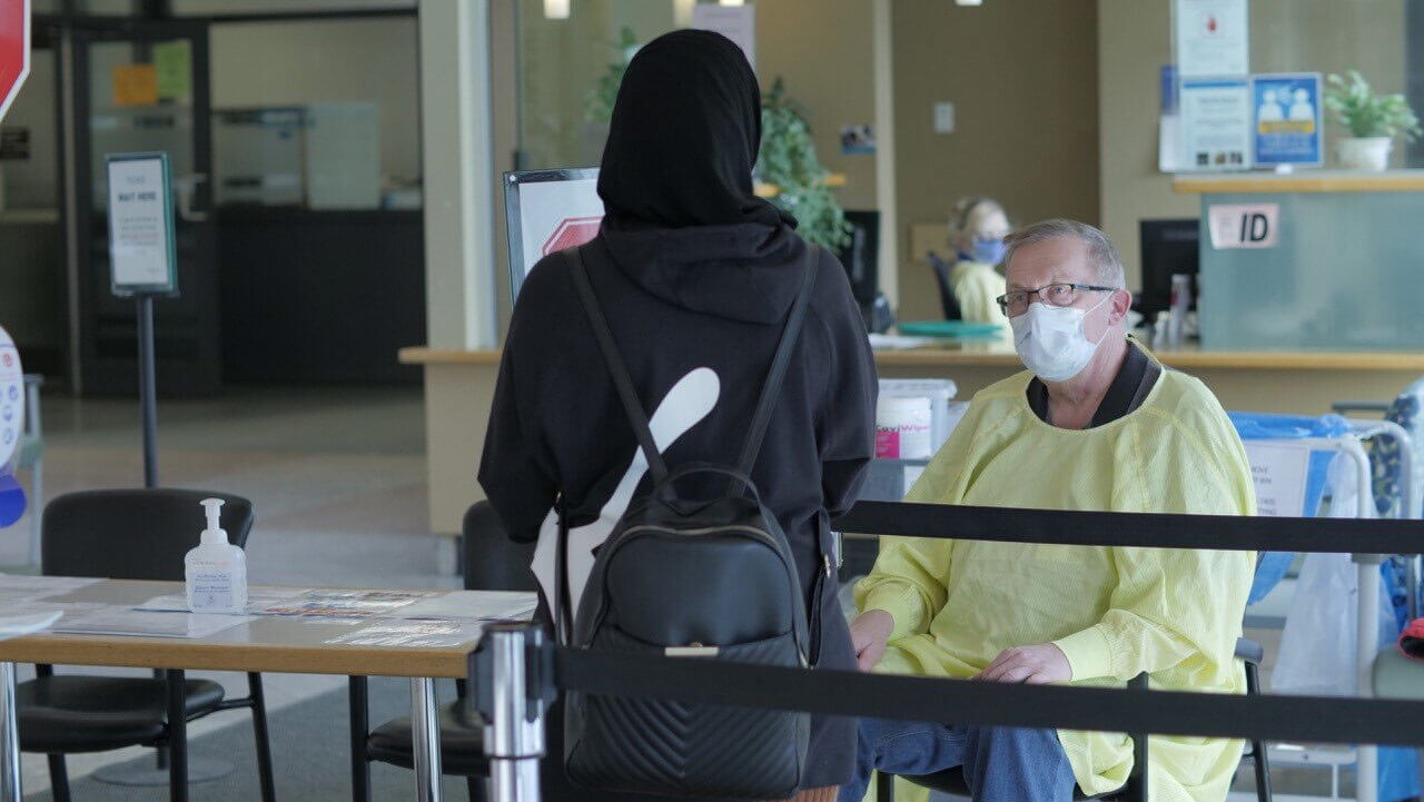 Screener Michael Reesick with a visitor