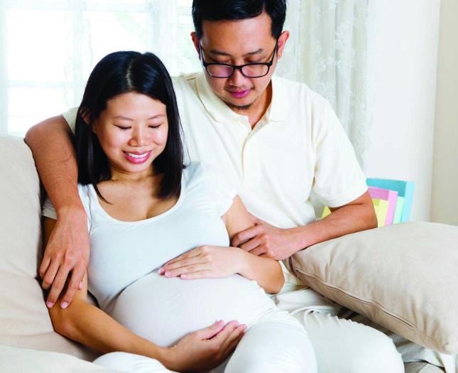 An expectant couple await the birth of their baby.