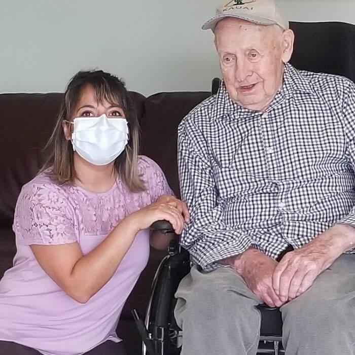 Occupational therapist Sheren Cherri poses with resident Guenter Bork